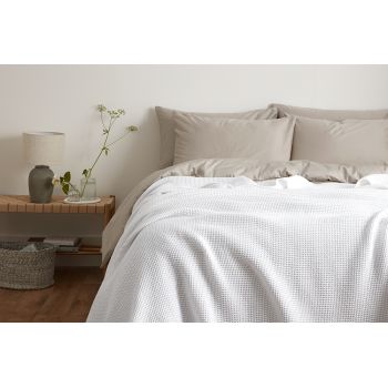 Stylish image of a complete bedspread set with coordinating pillow shams