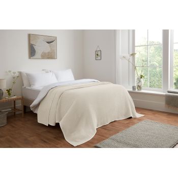 Image featuring a cotton bedspread in various soft pastel colors